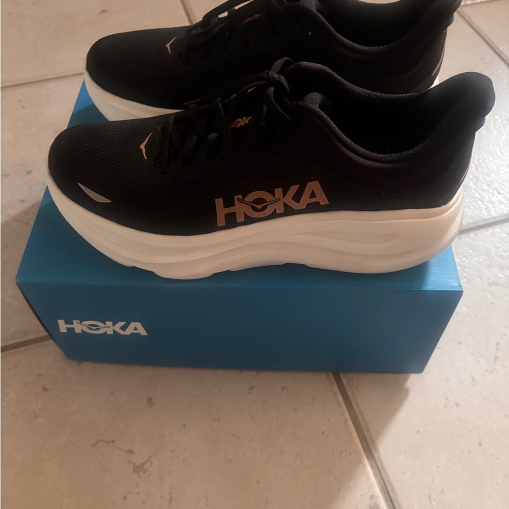 Hoka Black and White Sneakers with Gold Accents